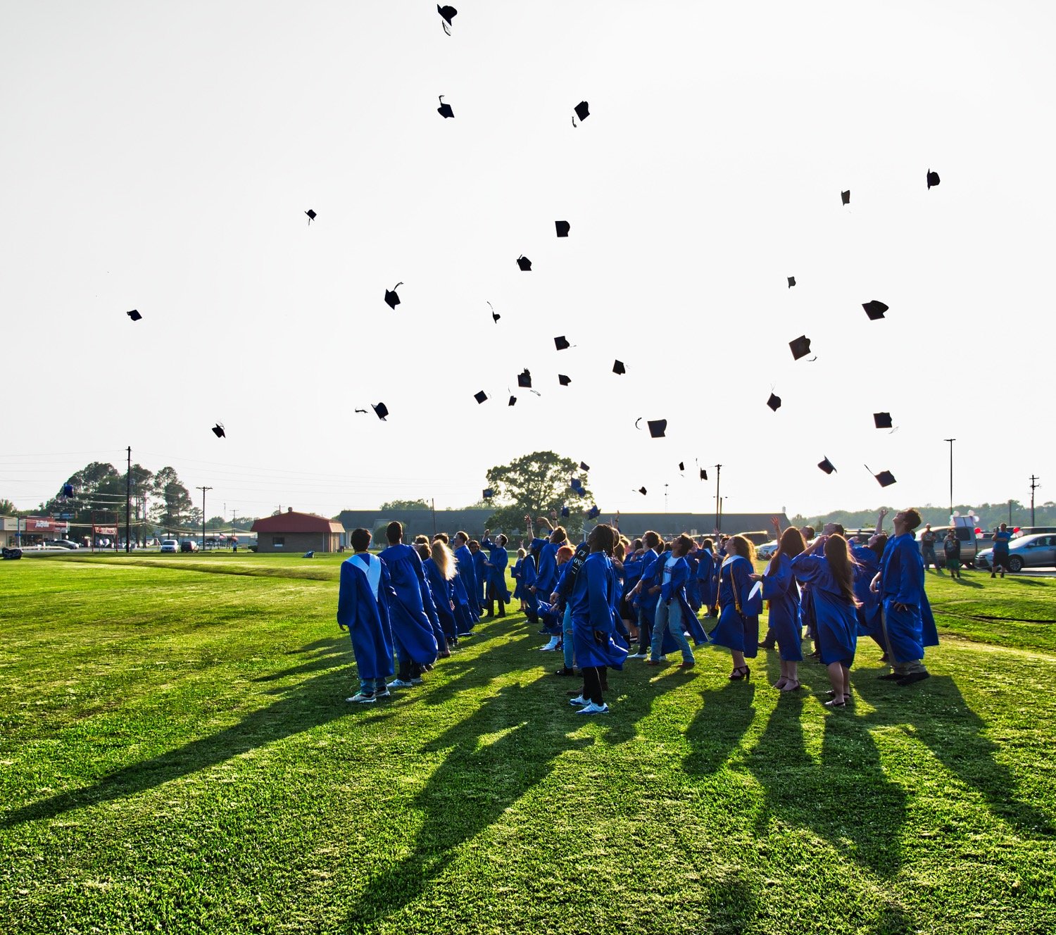 Though much of this May was unlike others, some traditions – like the annual tossing of caps by graduates – remained.